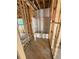 Bathroom framing during construction with tub, plumbing and electrical in place at 451 Courthouse Park Dr, Temple, GA 30179
