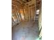 Unfinished bedroom showcases stud framing and open space, ready for customization to buyer's taste at 451 Courthouse Park Dr, Temple, GA 30179