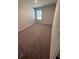 Cozy bedroom with neutral carpet, natural light from the window and fresh paint at 451 Courthouse Park Dr, Temple, GA 30179