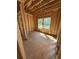 Bedroom framing during construction with windows, view of backyard and door frames at 451 Courthouse Park Dr, Temple, GA 30179