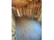 Spacious open-concept living room under construction featuring stud framing and open layout, primed for personalization at 451 Courthouse Park Dr, Temple, GA 30179