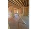 The living room features stud framing and an open space, ready for customization to buyer's taste and style at 451 Courthouse Park Dr, Temple, GA 30179