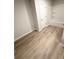 Bathroom featuring wood floors, bathtub and shower at 836 Courthouse Park Dr, Temple, GA 30179