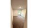 Carpeted bedroom with natural light from the window at 836 Courthouse Park Dr, Temple, GA 30179