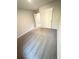 Spacious bedroom with plush neutral carpet and a closet at 836 Courthouse Park Dr, Temple, GA 30179
