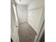 Walk-in closet with carpeted floor and white shelving at 836 Courthouse Park Dr, Temple, GA 30179