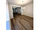 Open-concept dining room with modern flooring and seamless flow to living area at 836 Courthouse Park Dr, Temple, GA 30179