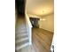 Inviting entryway featuring wood-look floors and a staircase leading to the upper level at 836 Courthouse Park Dr, Temple, GA 30179