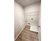 A practical laundry room equipped with shelving and essential utility connections at 836 Courthouse Park Dr, Temple, GA 30179