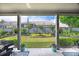 Enjoy the serene backyard view from the covered patio, showcasing manicured landscaping and a private fenced yard at 250 Cordova St, Woodstock, GA 30189