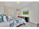 Comfortable bedroom with a warm ambiance, carpeted floors, and a mounted TV for relaxation at 250 Cordova St, Woodstock, GA 30189