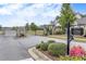 Gated community entrance with landscaped grounds and decorative signage at Heritage at Towne Lake at 250 Cordova St, Woodstock, GA 30189