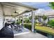 Relax on the covered patio, complete with outdoor dining and grilling area, overlooking a beautiful landscaped yard at 250 Cordova St, Woodstock, GA 30189