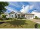 Charming single-Gathering home with a manicured lawn, gray siding, and a two-car garage at 250 Cordova St, Woodstock, GA 30189