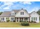 A charming single-Gathering home with a well-manicured lawn and a classic craftsman-style facade at 250 Cordova St, Woodstock, GA 30189