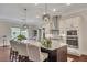 Kitchen island featuring seating and stainless appliances at 250 Cordova St, Woodstock, GA 30189