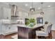 Kitchen with granite counters, island, stainless appliances, and white cabinetry at 250 Cordova St, Woodstock, GA 30189
