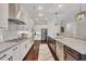 Kitchen features stainless appliances, granite counters, and white cabinets at 250 Cordova St, Woodstock, GA 30189