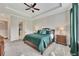 Spacious main bedroom with tray ceiling, large windows, dark curtains, and hardwood furniture at 250 Cordova St, Woodstock, GA 30189