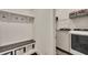 A mudroom provides practical convenience with built-in bench seating, storage, and modern washer and dryer units at 250 Cordova St, Woodstock, GA 30189