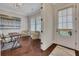 Bright and inviting office space featuring hardwood floors, a large window, and stylish decor at 250 Cordova St, Woodstock, GA 30189