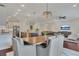Open floorplan view of kitchen, dining area and living room with lots of natural light and hardwood floors at 250 Cordova St, Woodstock, GA 30189