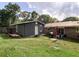 A storage shed sits adjacent to a brick home, surrounded by lush greenery at 4179 Westview St, Douglasville, GA 30135