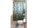 Full bathroom view featuring a toilet, sink, and a shower curtain with a butterfly pattern at 4179 Westview St, Douglasville, GA 30135