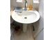 Pedestal sink with chrome faucet and accessories, complemented by neutral tile walls at 4179 Westview St, Douglasville, GA 30135