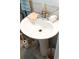 Pedestal sink with chrome faucet and accessories, complemented by neutral tile walls at 4179 Westview St, Douglasville, GA 30135