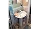 Pedestal sink with chrome faucet and accessories, complemented by neutral tile walls at 4179 Westview St, Douglasville, GA 30135