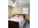 Inviting bedroom with bright yellow walls, a ceiling fan, and a cozy atmosphere at 4179 Westview St, Douglasville, GA 30135
