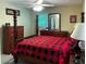 Cozy bedroom featuring a four-poster bed with checkered bedding, complemented by matching dressers at 4179 Westview St, Douglasville, GA 30135