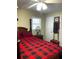 Bedroom featuring a four-poster bed, complimented by neutral colored walls and a ceiling fan at 4179 Westview St, Douglasville, GA 30135