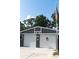 Two-car garage featuring matching white garage doors with the Bulldogs emblem, great curb appeal at 4179 Westview St, Douglasville, GA 30135