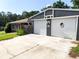 Two-car garage featuring matching white garage doors with the Bulldogs emblem, great curb appeal at 4179 Westview St, Douglasville, GA 30135