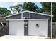 Two-car garage featuring matching white garage doors with the Bulldogs emblem, great curb appeal at 4179 Westview St, Douglasville, GA 30135