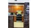View of the kitchen, including the cabinets, countertops, and the appliances, as seen from an adjacent brick-lined entryway at 4179 Westview St, Douglasville, GA 30135