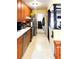 Kitchen with stainless steel appliances, wooden cabinets and white countertops, as seen from a narrow angle at 4179 Westview St, Douglasville, GA 30135