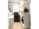 Functional laundry room with shelving, laundry basket, and washer and dryer at 4179 Westview St, Douglasville, GA 30135