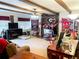 Spacious living room featuring a brick accent wall, fireplace, and various decorative items. Go Bulldogs! at 4179 Westview St, Douglasville, GA 30135