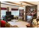 Inviting living room with brick accents, a cozy fireplace, and comfortable seating. Go Bulldogs! at 4179 Westview St, Douglasville, GA 30135