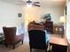 Cozy living room with ceiling fan, lamps, chairs and vintage furniture, offering a comfortable gathering space at 4179 Westview St, Douglasville, GA 30135
