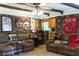 Comfortable living room with brick accents, leather couches, and a view into the adjacent kitchen area at 4179 Westview St, Douglasville, GA 30135