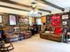 Cozy living room with brick walls, beamed ceiling, and comfortable seating at 4179 Westview St, Douglasville, GA 30135
