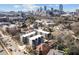 Picturesque aerial view of modern townhomes nestled amongst lush trees with city views at 456 Parkway Ne Dr # 10, Atlanta, GA 30308