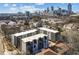 Aerial view of modern townhomes with a cityscape backdrop at 456 Parkway Ne Dr # 10, Atlanta, GA 30308