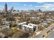 Stunning aerial view of new modern townhomes and the vibrant city skyline at 456 Parkway Ne Dr # 10, Atlanta, GA 30308