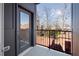 Private balcony offers an outdoor view with trees and rooftops visible at 456 Parkway Ne Dr # 10, Atlanta, GA 30308
