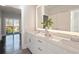 Bright bathroom with double vanity, backlit mirror, and quartz counters at 456 Parkway Ne Dr # 10, Atlanta, GA 30308